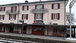 Three-story building with gabled roof