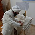 Tarmida Sahi Bashikh preparing the drabsha at Yahya Yuhana Mandi in Sydney, Australia