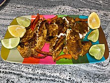 Blackened tilapia with Cajun spices, lemon and lime juice