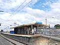 Southbound view of Platform 1 and the station building, October 2019