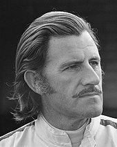 A black and white photograph of Graham Hill in 1971