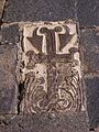 Decorative stone embedded into the wall near the apse.