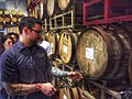 Image 49A beer sommelier tapping a barrel for a taste at Nebraska Brewing Company (from Craft beer)