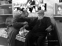 Two men sitting together