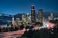 Skyline of city at dusk. A major highway winds itself into the downtown area. (from Transport)