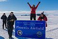 A group of engineers involved in the airfield's construction celebrates the airfield's completion, 2017