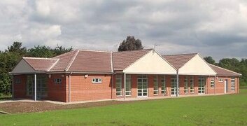 The Village Hall and Community Shop (located at the rear)