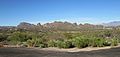 The foothills south of the Tucson Mountains. Beehive Peak is at the center-left, Cat Mountain is at the far left. The Catalina Mountains are in the background at right.