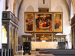 El retablo en la Iglesia de la ciudad de Wittenberg o Iglesia de Santa María de Wittenberg (Stadtkirche -Stadtkirche Wittenberg, Stadtkirche Lutherstadt Wittenberg, de:Stadtkirche-), no debe confundirse con la Iglesia de Todos los Santos o Iglesia del Castillo (Schlosskirche -All Saints' Church, Wittenberg, Schlosskirche (Lutherstadt Wittenberg)-).