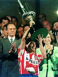 Paulo Futre holding the Copa del Rey trophy after winning the final to Real Madrid.