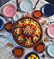 Image 1Couscous is traditionally enjoyed on Friday, the holy day in Islam. Garnished with vegetables and chickpeas, it is served communally. (from Culture of Morocco)