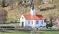 Tjugum kyrkje sett frå fjorden Foto: C. Hill, 2011