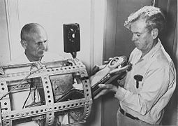 Miss Sam, with fiberglass couch, being placed in a container for the Little Joe 1B flight