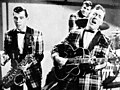 Image 9Bill Haley and his Comets performing in the 1954 Universal International film Round Up of Rhythm (from Rock and roll)