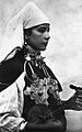 Image 15A Berber musician wearing two large triangular brooches in southern Morocco (early 20th century photo) (from Culture of Morocco)