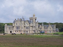 A photograph of the front facade of Balfour Castle