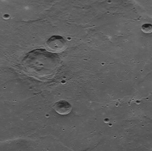 Oblique view of Fet crater (upper left) in Tir Planitia, showing the nature of the smooth plain