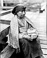 A Nuu-chah-nulth woman selling baskets in Nootka Sound in the 1930s