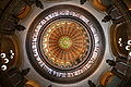 Image 17The dome of the Illinois State Capitol. Designed by architects Cochrane and Garnsey, the dome's interior features a plaster frieze painted to resemble bronze and illustrating scenes from Illinois history. Stained glass windows, including a stained glass replica of the State Seal, appear in the oculus. Ground was first broken for the new capitol on March 11, 1869, and it was completed twenty years later. Photo credit: Daniel Schwen (from Portal:Illinois/Selected picture)