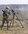 A soldier with the Ukrainian Land Forces fires a DShKM