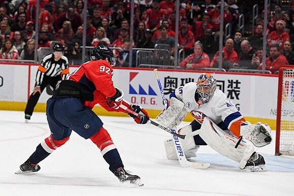 Semyon Varlamov makes save on Evgeny Kuznetsov.jpg