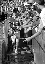 Tim Tebow being congratulated by young fans