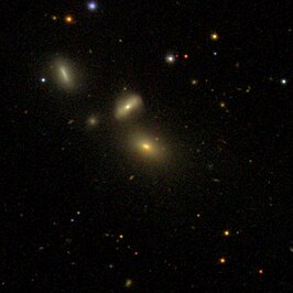 NGC 3010C (linksboven)