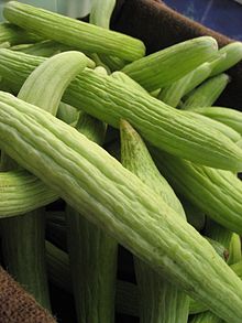 Several Armenian cucumbers in a fabric-covered box.