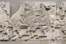 A Greek sculpture showing cavalrymen riding right to left in procession