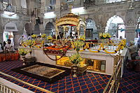 Gurudwara Sis Ganj Sahib in Delhi. The long window under the marble platform is the location where Guru Tegh Bahadur was executed by the Mughals.