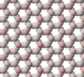 View of tetrahedral sheet structure of biotite. The apical oxygen ions are tinted pink.