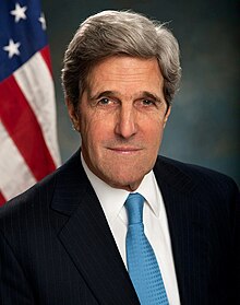 John Kerry dressed in a black suit seen in his official secretary of state portrait in 2013