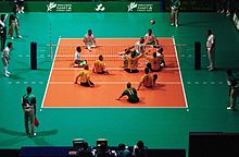 people playing sitting volleyball