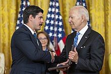 Trumka (left) accepts the Presidential Medal of Freedom presented posthumously to his late father in July 2022.