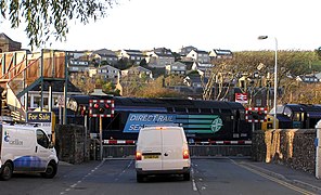 A full barrier level crossing in St Bees, Cumbria, that is controlled by the adjacent signal box