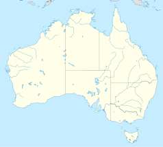 Mapa konturowa Australii, blisko prawej krawiędzi nieco na dole znajduje się punkt z opisem „Macksville”