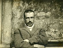 Photo de Nelligan âgé d'environ quarante ans, le cheveu rare, moustache fine, le regard fixe.