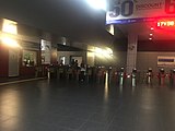 The fare gates and information counter on the ground level.