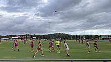 Tahlia Hickie (Brisbane) competes in a ruck contest against Sophie Alexander (Collingwood) during the Lions' Round 5 victory over the Magpies at Maroochydore Multi Sports Complex.