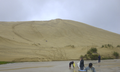 Surfing on sand in Ninety Mile Beach, New Zealand