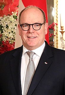 A photo of a balding Prince Albert, 58, smiling