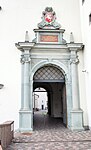 Main gates of the Palace of the Grand Dukes of Lithuania with the front portal featuring Vytis in Vilnius