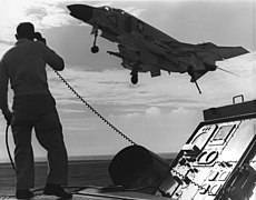 An F-4B from VF-21 as part of CVW-2 returns to the USS Midway after a combat mission over Vietnam in 1965.