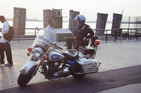 A Highway Patrol officer speaks with a passerby