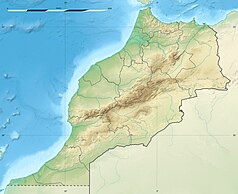 Mapa konturowa Maroka, w centrum znajduje się czarny trójkącik z opisem „Atlas Wysoki”