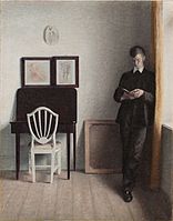 Vilhelm Hammershøi: Interieur mit jungem, lesenden Mann, 1898