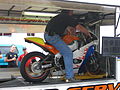 Motorcycle rear wheel on a dyno roller.