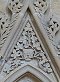 Chapter house stall canopy tympanum showing green man