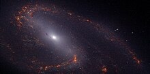 Una versión en "falso color" de Messier 66 sacada por el Telescopio Espacial James Webb