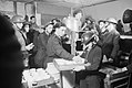 Tea and buns are supplied by local ARP workers to fellow workers and civilians in a basement shelter in south east London, 1940